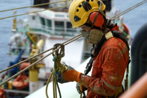An,Abseiler,Wearing,Personal,Protective,Equipment,(ppe),Such,As,Respiratory