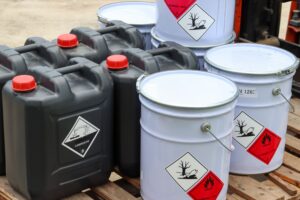 Corrosive,Chemical,Symbols,On,A,Black,Chemical,Tank,,Dangerous,Products