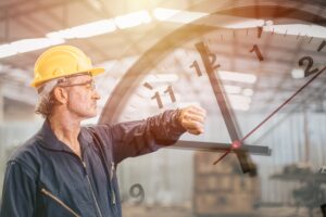 Engineer,Senior,Mananger,Worker,Looking,At,Wristwatch,Overlay,Time,Clock