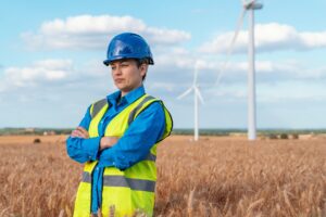 Female,Wind,Energy,Specialist,Monitors,Turbine,Operations,In,Field,,Showcasing