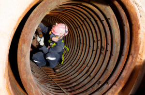 Male,Workers,Check,The,Thickness,Of,Pipes,In,Confined,Spaces