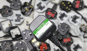 Plan,View,Of,Plugs,,Blurred,Background,Of,Three,Pin