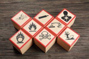 Wooden,Blocks,Showing,Different,Symbols,Of,Chemical,Hazard,Warnings,On