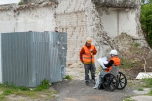 Woman,In,Wheelchair,Works,As,Engineer,At,Construction,Site,,Disabled