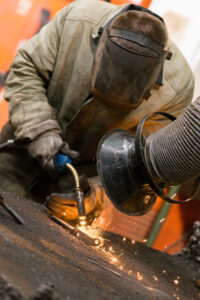 manufacture-worker-welding-metal-factory-workshop